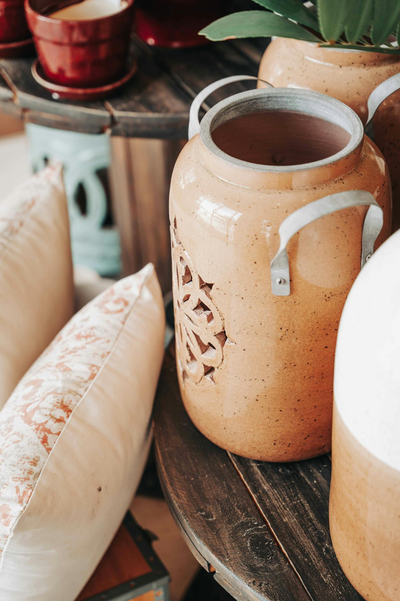 Close-up of a handmade ceramic jug with decorative designs, ideal for interior decor.